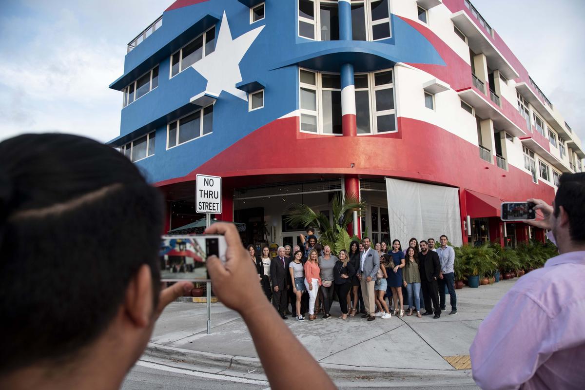 Members of the Puerto Rican diaspora in La Placita take a photo after a meeting in July to discuss the political crisis involving former Gov. Ricardo Rosselló.