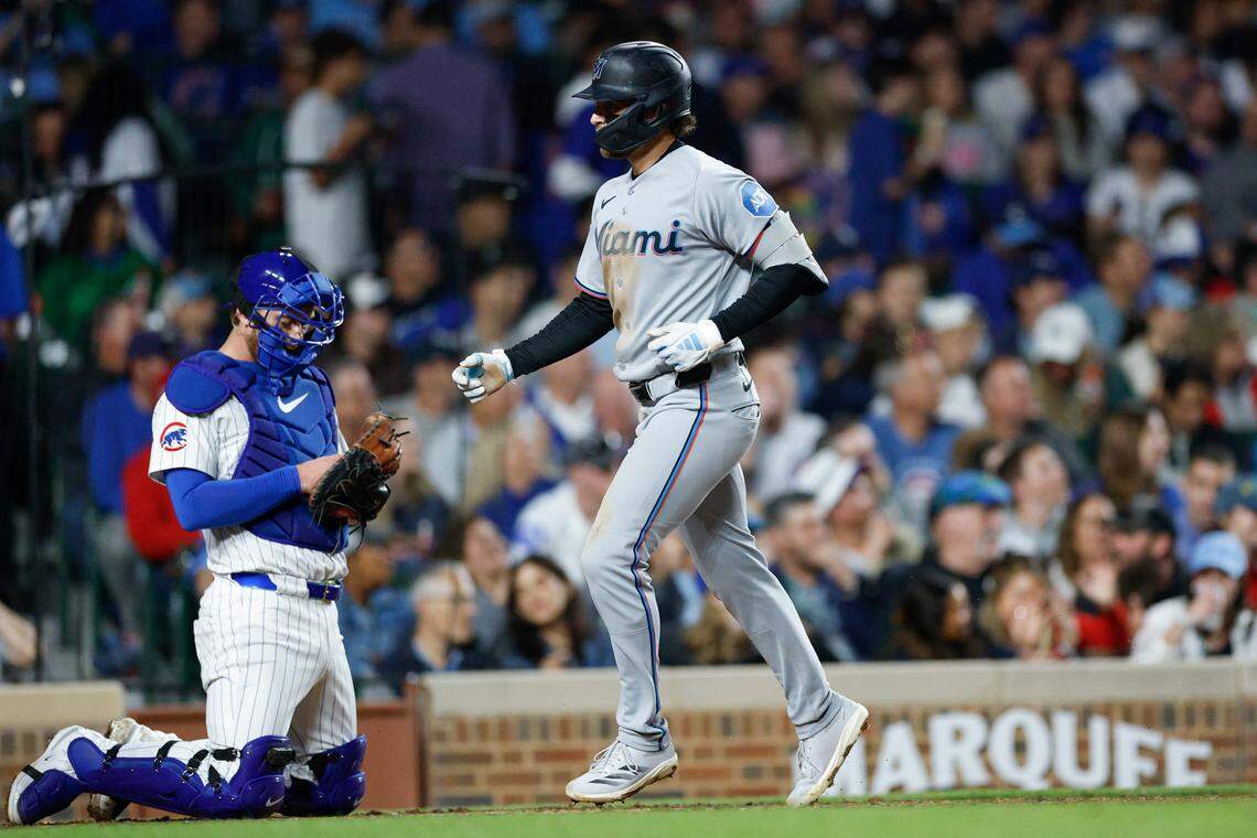 May 13, 2025; Chicago, Illinois, USA; Miami Marlins third baseman Connor Norby (1) crosses home plate after hitting a solo home run against the Chicago Cubs during the seventh inning at Wrigley Field. Mandatory Credit: Kamil Krzaczynski-Imagn Images
