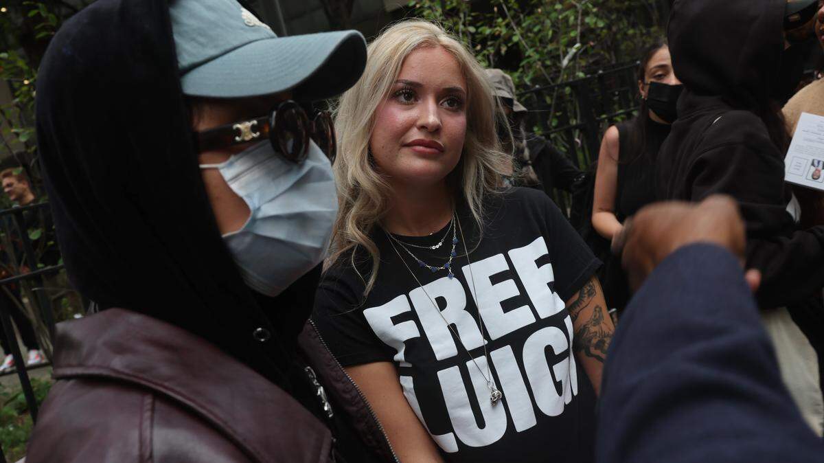NEW YORK, NEW YORK - SEPTEMBER 16: Supporters of Luigi Mangione gather following a hearing where terrorism charges against him were dismissed in the murder of UnitedHealth Care CEO Brian Thompson, outside of Manhattan Supreme Court on September 16, 2025 in New York City. Mangione is accused of murdering UnitedHealthcare CEO Brian Thompson late last year. He is facing 11 counts for the December 4th shooting outside a midtown Manhattan hotel, which set off a massive manhunt. He is also facing federal charges of murder and other charges in Pennsylvania, where he was arrested. (Photo by Spencer Platt/Getty Images)