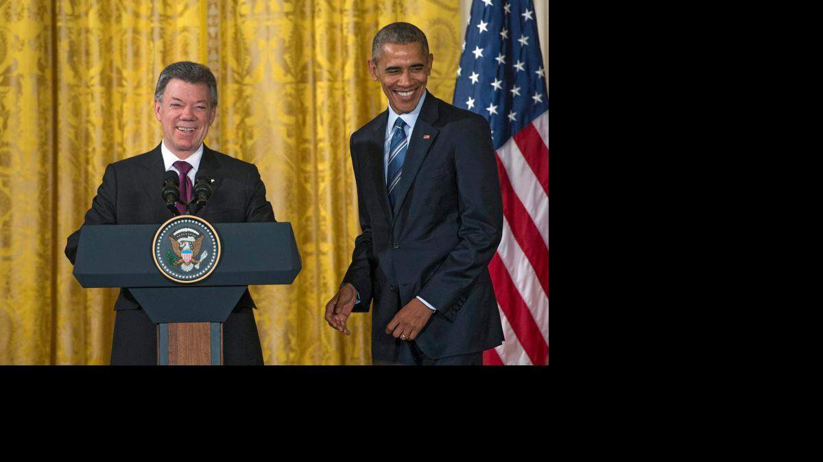 El presidente de Colombia, Juan Manuel Santos, comparte el podio junto al presidente de EEUU, Barack Obama, el lunes en la Casa Blanca en Washington. 