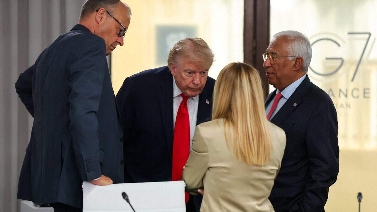 TOPSHOT - (From L) Germany's Chancellor Friedrich Merz, US President Donald Trump, Italy's Prime Minister Giorgia Meloni and European Council President Antonio Costa attend a work lunch as part of the G7 summit, in Evian, eastern France, on June 16, 2026. A G7 summit is set to take place June 15 to 17 in the French town of Evian-les-Bains near Switzerland and it will be attended by country leaders as well as the EU's foreign policy chief and ministers from Brazil, Canada, the United Arab Emirates and Turkey. (Photo by Christian Hartmann / POOL / AFP via Getty Images)