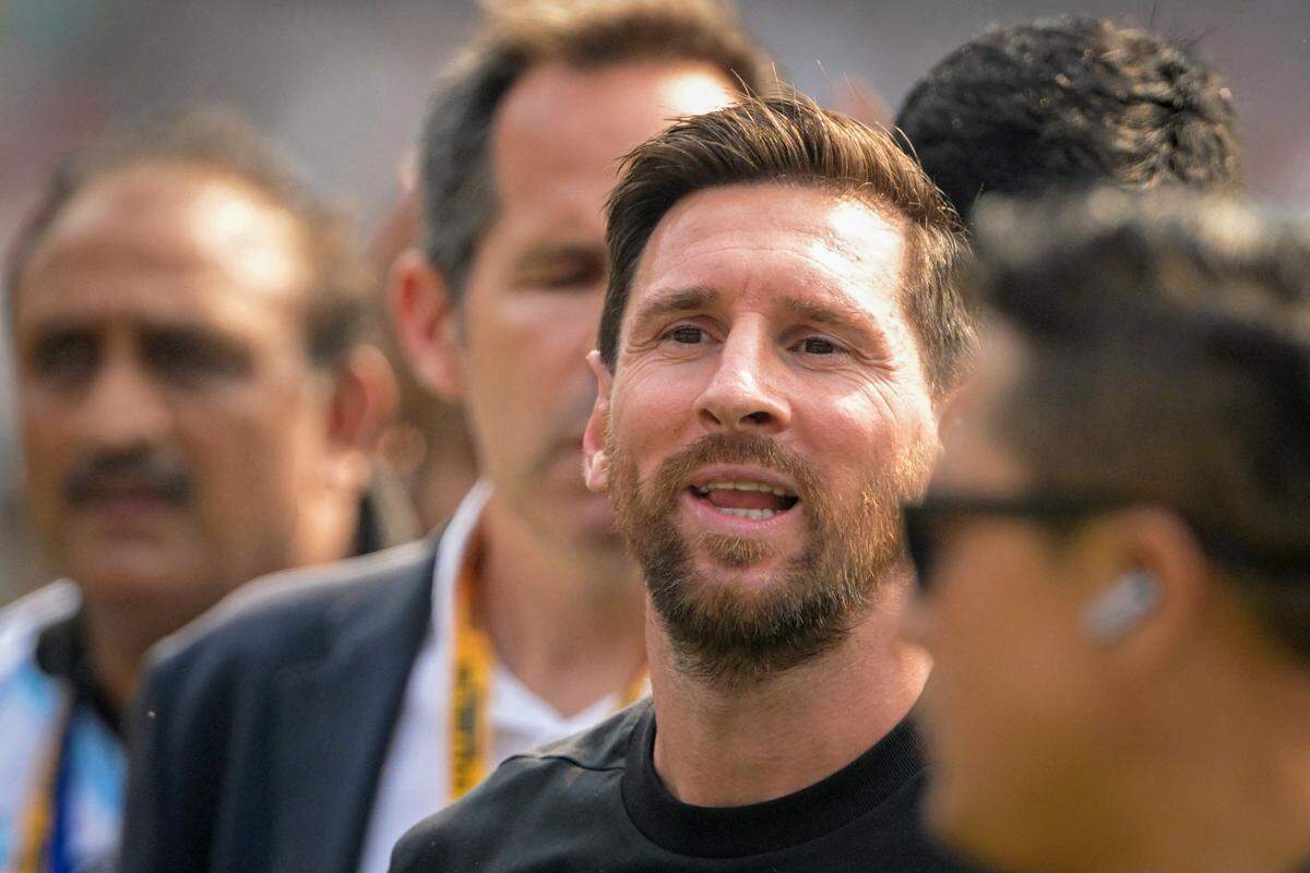 Argentina's footballer Lionel Messi arrives during his GOAT Tour at Salt Lake Stadium in Kolkata on December 13, 2025. Angry spectators broke down barricades and stormed the pitch at a stadium in India after football star Lionel Messi, who is on a three-day tour of the country, abruptly left the arena. As a part of a so-called GOAT Tour, the 38-year-old Argentina and Inter Miami superstar touched down in the eastern state of West Bengal early on December 13, greeted by a chorus of exuberant fans chanting his name. (Photo by Dibyangshu SARKAR / AFP via Getty Images)