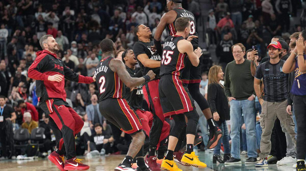 Feb 1, 2025; San Antonio, Texas, USA; Miami Heat players celebrate after center Bam Adebayo (13) scored the winning basket at the end of the game to defeat the San Antonio Spurs at Frost Bank Center. Mandatory Credit: Scott Wachter-Imagn Images