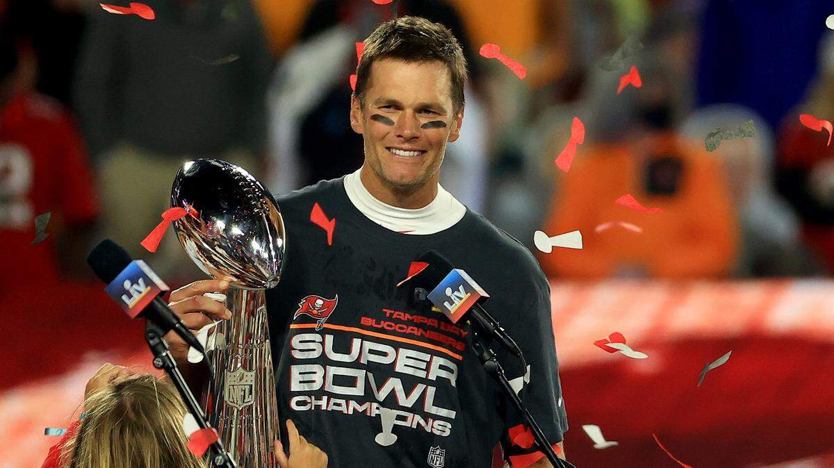 Tampa Bay Buccaneers quarterback Tom Brady hoists the Vince Lombardi Trophy after winning Super Bowl 55 at Raymond James Stadium on Feb. 7, 2021 in Tampa.