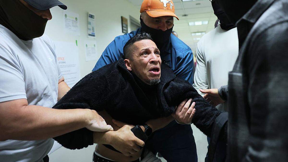 NEW YORK, NEW YORK - OCTOBER 27: A man seeking asylum from Colombia is detained by federal agents as he attends his court hearing in immigration court at the Jacob K. Javitz Federal Building on October 27, 2025 in New York City. Immigration and Customs Enforcement (ICE) agents and other federal agencies continue to detain people in immigration courts as they attend their court hearings, despite a government shutdown that is now in its 27th day, the second-longest shutdown in U.S. history. (Photo by Michael M. Santiago/Getty Images)