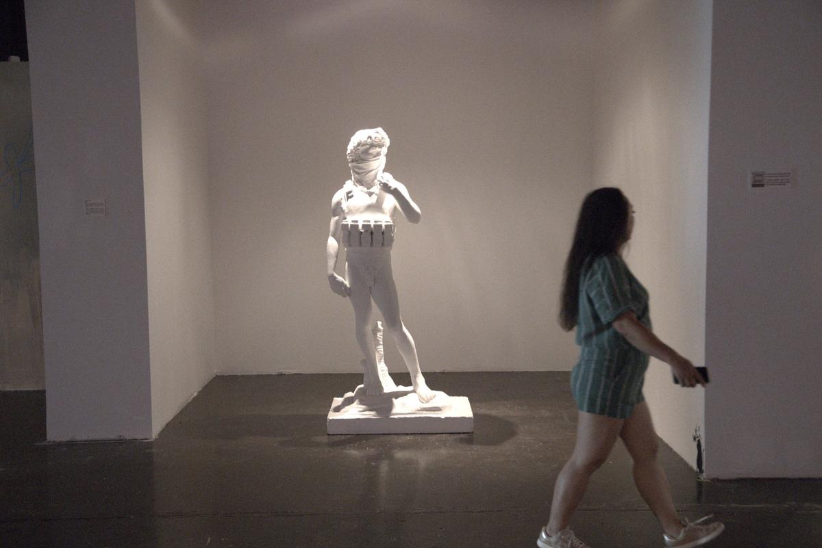 Miami, February 25, 2022 - A work titled ‘Suicide man’ at The Art of Banksy: “Without Limits” at the Ice Palace Studios, 1400 N Miami Ave, Miami, FL, 33136