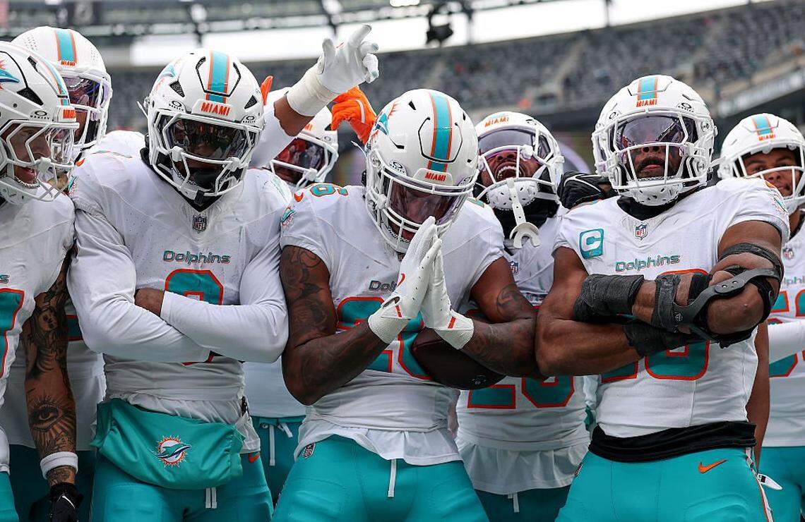 EAST RUTHERFORD, NEW JERSEY - DECEMBER 07: Rasul Douglas #26 of the Miami Dolphins celebrates with teammates after an interception against the New York Jets during the second quarter at MetLife Stadium on December 07, 2025 in East Rutherford, New Jersey. (Photo by Kenneth Richmond/Getty Images)