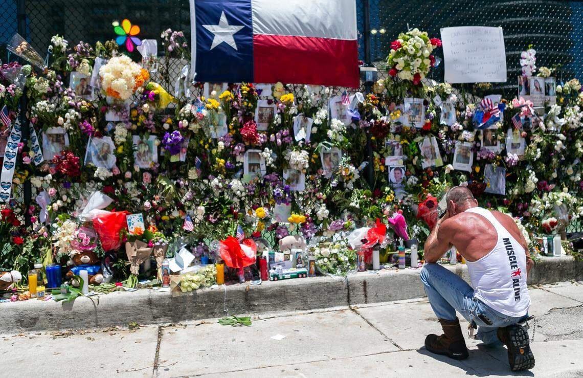 Mourners visit a makeshift memorial near the site of the collapsed Champlain Towers South Condo in Surfside, Florida on Saturday, July 3, 2021.