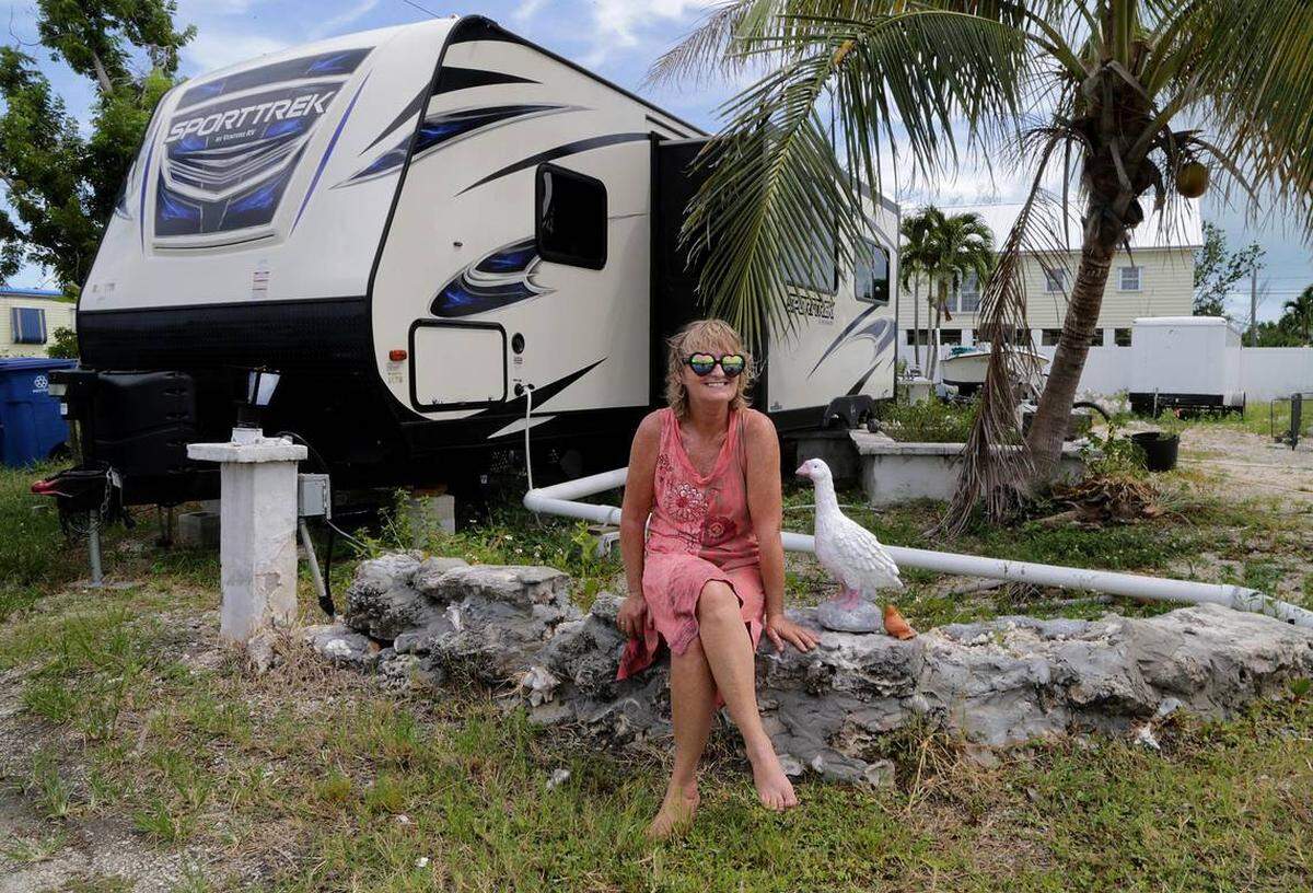 Christine King sits in front of her FEMA trailer that replaced the home she lost to Hurricane Irma’s wrath on Big Pine Key.