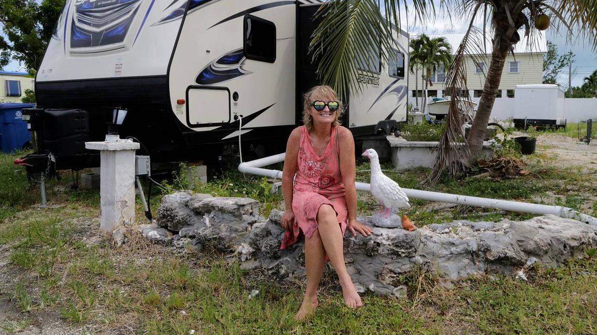 Christine King in August 2018 sits in front of her FEMA trailer that replaced the home she lost to Hurricane Irma’s wrath on Big Pine Key.