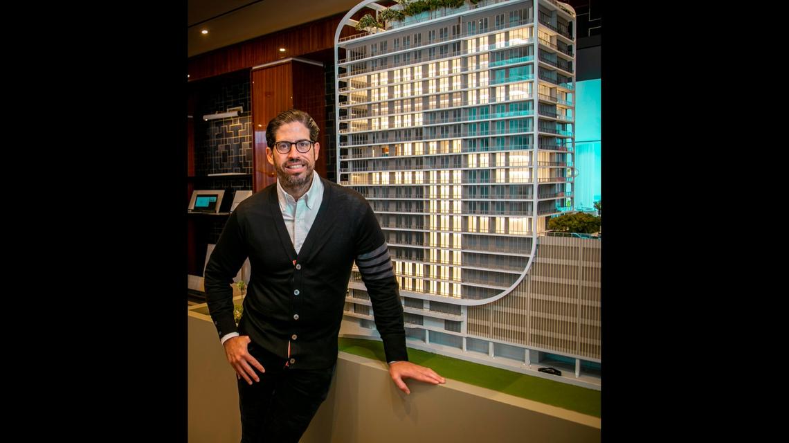 David Martin, CEO of Miami-based development firm Terra, stands next to a scale model of Mr. C Residences Coconut Grove on April 14, 2021. Martin was the lead developer for Eighty Seven Park.