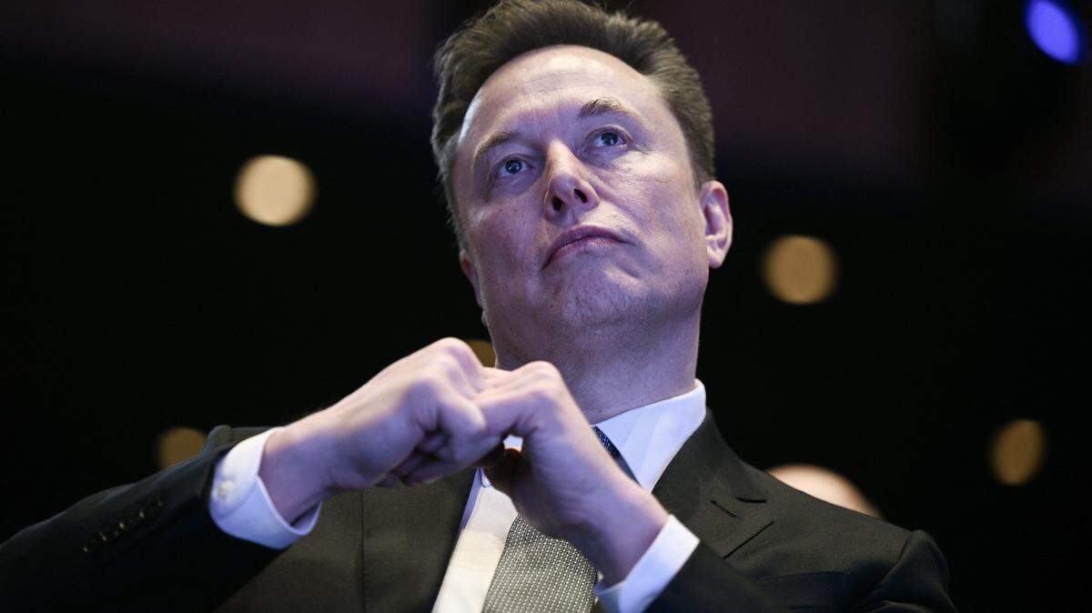 Elon Musk looks on as US President Donald Trump speaks at the US-Saudi Investment Forum at the John F. Kennedy Center for the Performing Arts in Washington, DC on November 19, 2025. (Photo by Brendan SMIALOWSKI / AFP) (Photo by BRENDAN SMIALOWSKI/AFP via Getty Images)