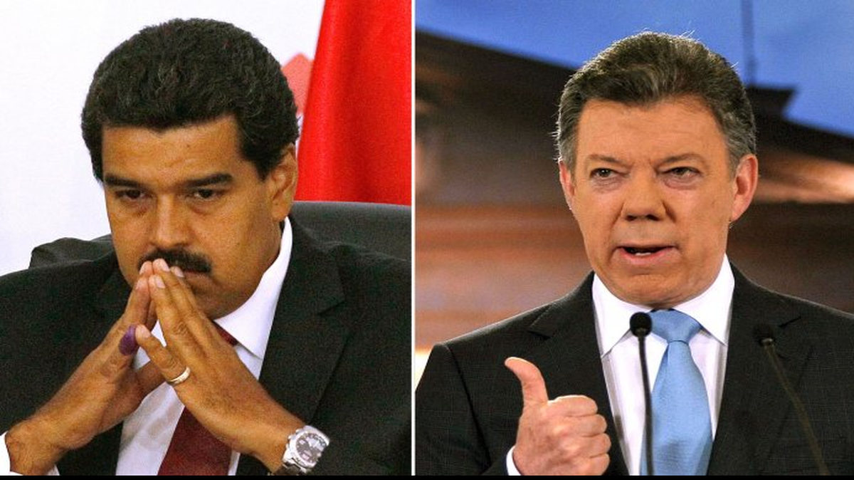 El presidente de venezuela Nicolás Maduro (izq.), y el presidente colombiano Juan Manuel Santos. 