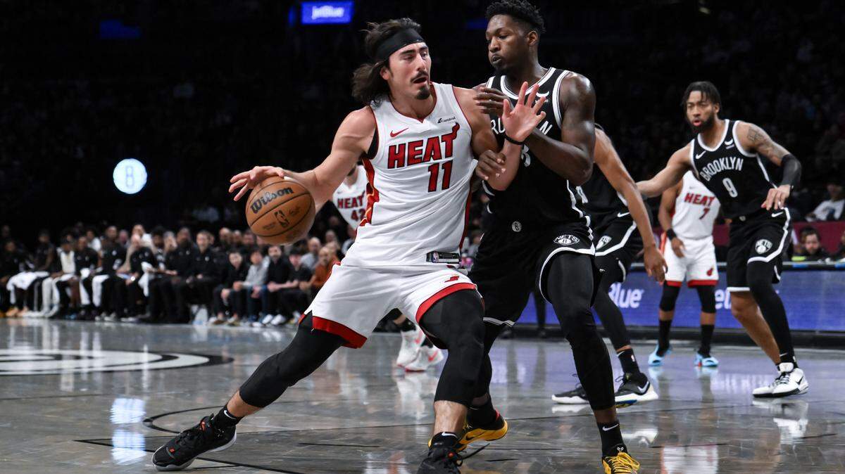 Nov 25, 2023; Brooklyn, New York, USA; Miami Heat guard Jaime Jaquez Jr. (11) drives to the basket against Brooklyn Nets forward Dorian Finney-Smith (28) during the first quarter at Barclays Center. Mandatory Credit: John Jones-USA TODAY Sports