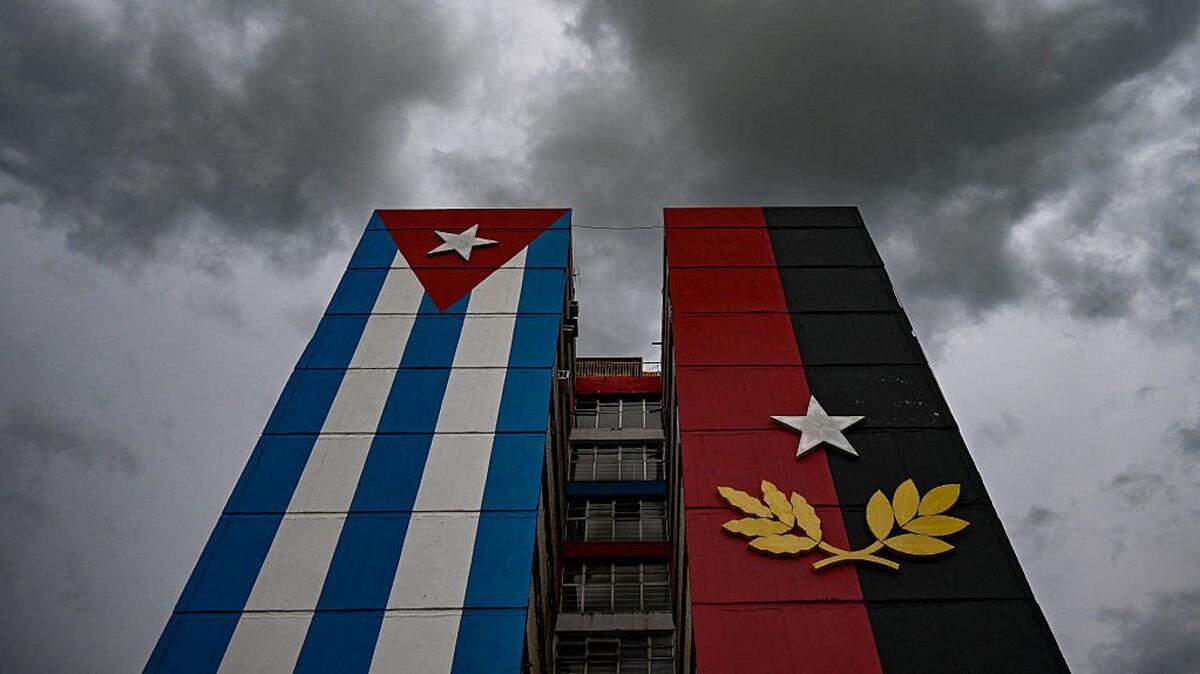 A 26th of July Movement flag painted on a building is seen in tribute to the 72nd anniversary of the assault on the Moncada Barracks in 1953, in Ciego de Avila province, Cuba on July 23, 2025. The Cuban government on July 26 will commemorate the 72nd anniversary of the guerrilla assault on the Moncada Barracks, widely regarded as the beginning of the Cuban Revolution. (Photo by YAMIL LAGE / AFP) (Photo by YAMIL LAGE/AFP via Getty Images)