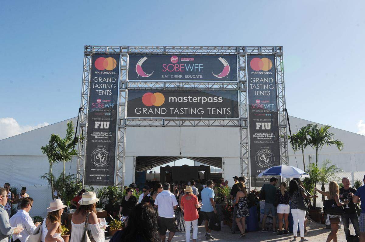 Foodies enter the vast Goya Grand Tasting tent at the South Beach Wine & Food Festival. The Grand Tastings are also competitive events for the festival.