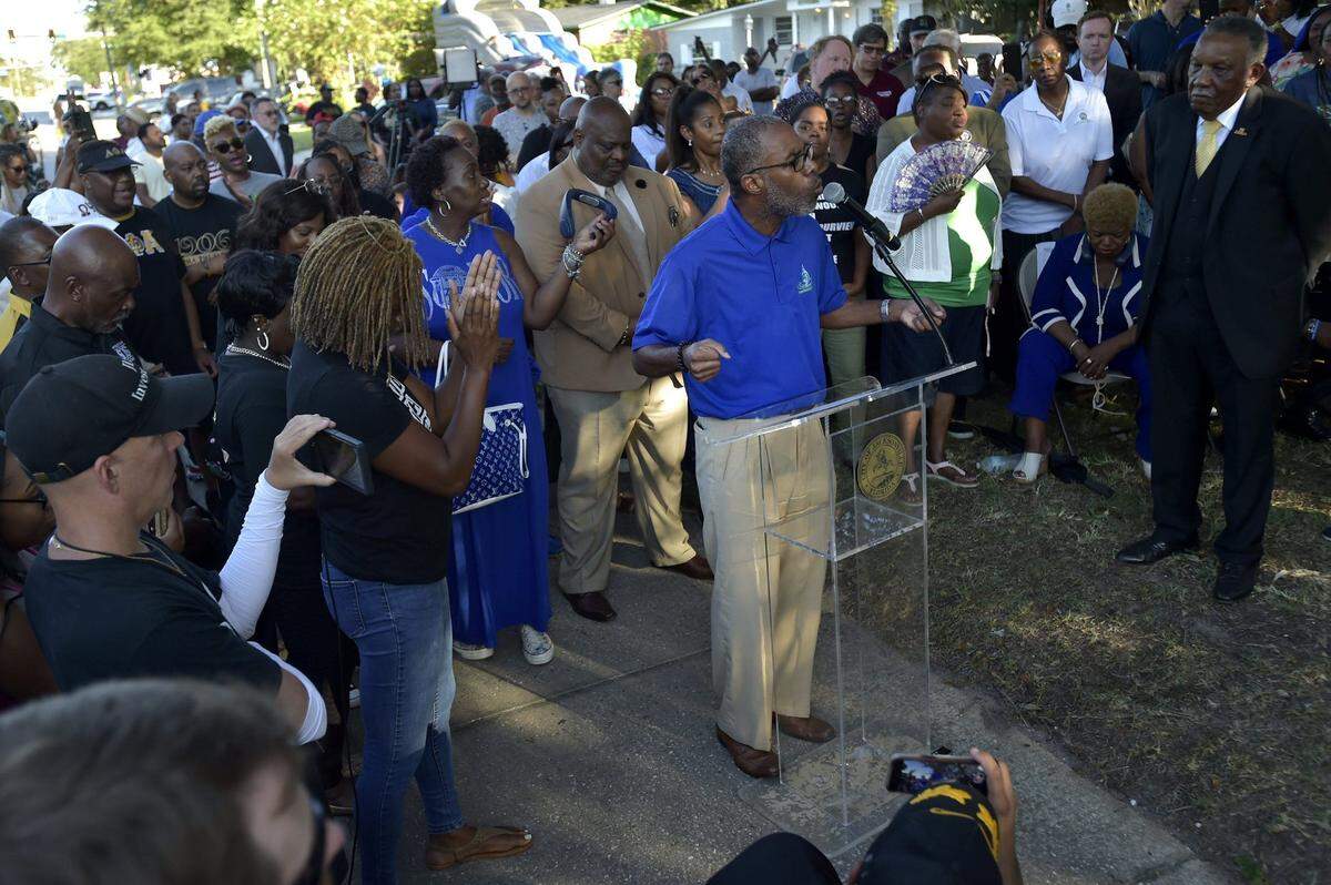 Pastor Jeffrey Rumlin addresses the audience during Sunday night’s prayer vigil to express frustration and weariness over the racist attack in Jacksonville, Florida.