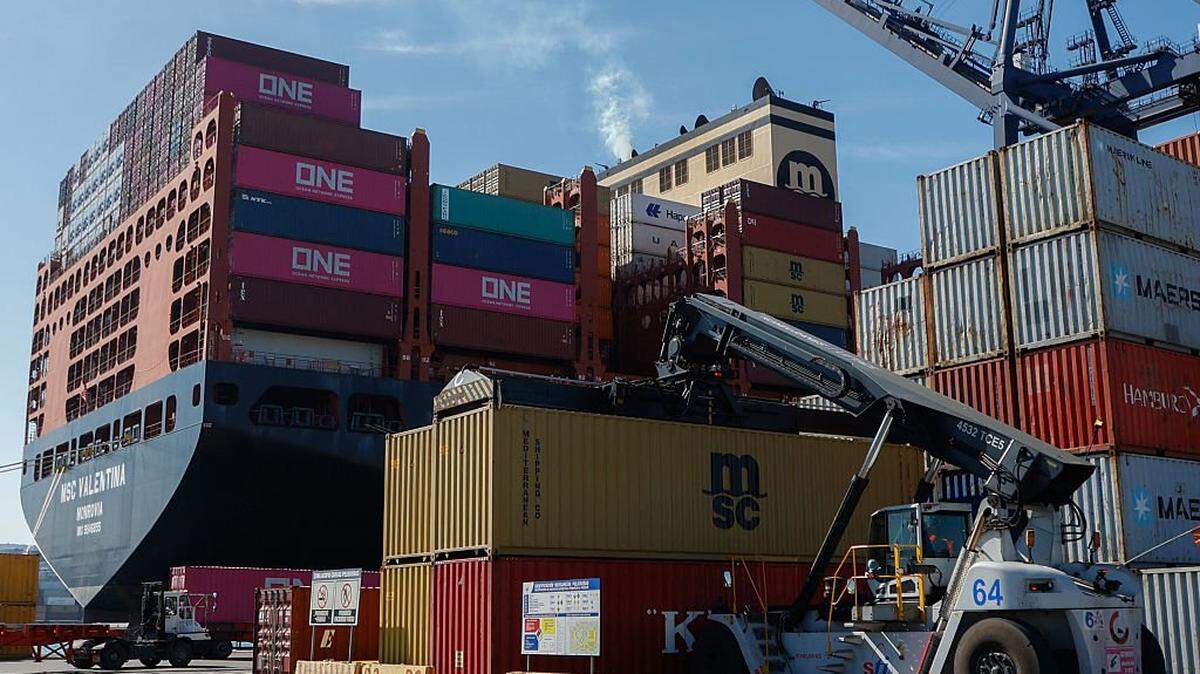 A crane lifts a container at the Port of San Antonio, which is set to undergo expansion works shortly, in Valparaiso region, Chile, on September 24, 2025. (Photo by Raul BRAVO / AFP) (Photo by RAUL BRAVO/AFP via Getty Images)