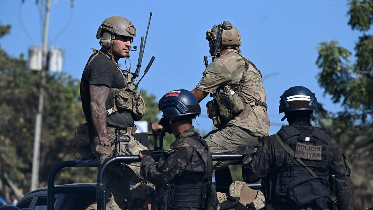 Us soldiers and Venezuelan military police patrol the streets of La Guaira, Venezuela on June 29, 2026, following twin earthquakes. Hopes were fading on June 29, 2026 of finding survivors more than four days after powerful twin earthquakes struck Venezuela, as residents grow increasingly frustrated with the government's response to the disaster that has killed at least 1,450 people and left tens of thousands unaccounted for. (Photo by Juan BARRETO / AFP via Getty Images)