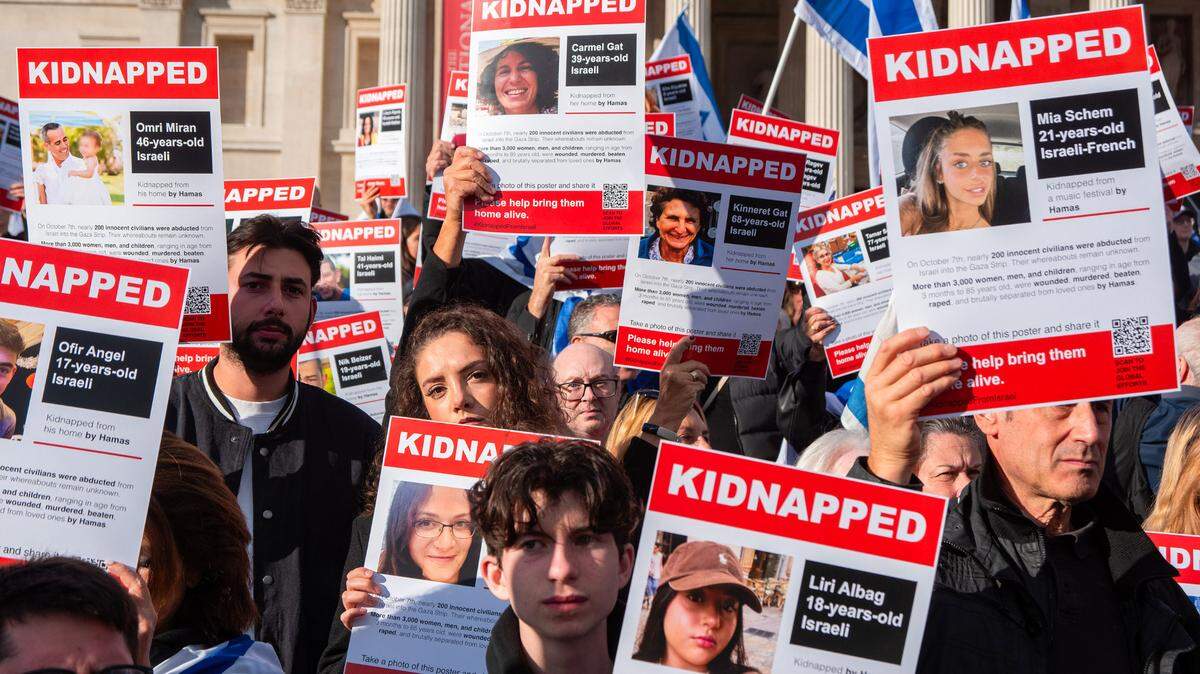 Protesters hold placards with the names of Hamas hostages taken from Israel during the demonstration in Trafalgar Square in London.