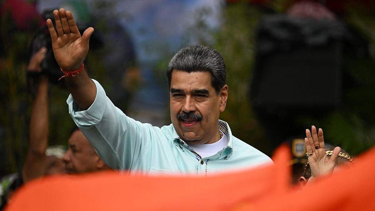 Venezuela's President Nicolas Maduro gestures during a rally to mark the anniversary of the Battle of Santa Ines, in Caracas on December 10, 2025. (Photo by Federico PARRA / AFP via Getty Images)