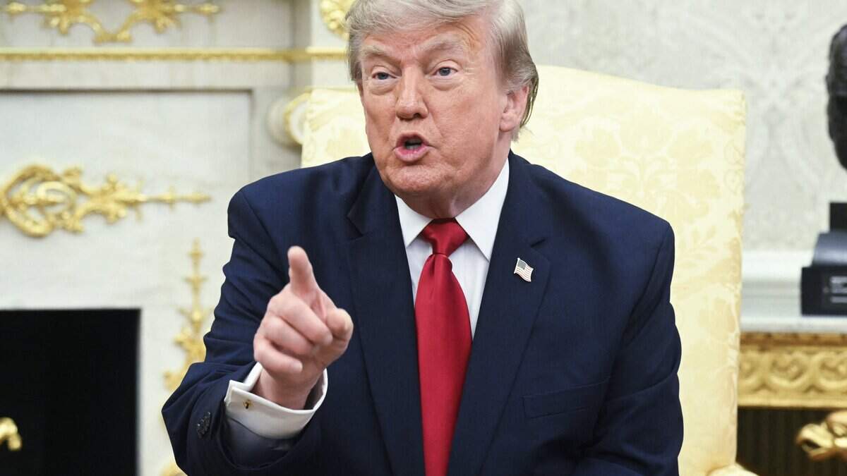 US President Donald Trump takes questions from reporters during a meeting with Prime Minister of Iraq Ali al-Zaidi in the Oval Office of the White House in Washington, DC, on July 14, 2026. (Photo by SAUL LOEB / AFP via Getty Images)
