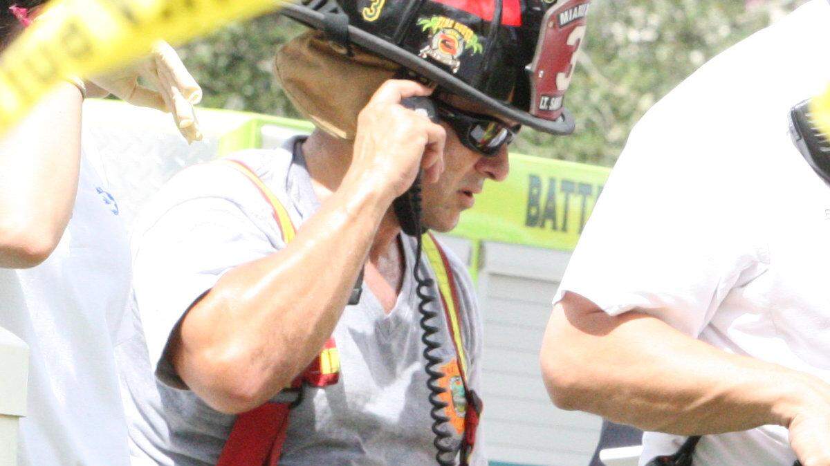 Miami_Dade Fire Rescue works on one of the injured construction workers at the scene of a parking lot collapse at the West Campus parking lot of the Miami-Dade College in Doral that was under construction and collapse the day October 10, 2012.