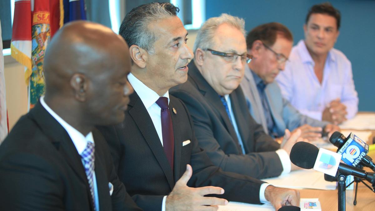 Left to right, Kionne McGhee, Representative, Robert Asencio, Paul Carl Velez, Chief Executive Officer at Borinquen Medical Center, Luis DeRosa, President of the Puerto Rican Chamber Commerce and Actor, Osvaldo Rios, during a press conference with private sector and community organizations requesting immediate help for displaced Puerto Rican and US Virgin Island families, at the Borinquen Medical Center in Miami on Thursday, July 19, 2018.