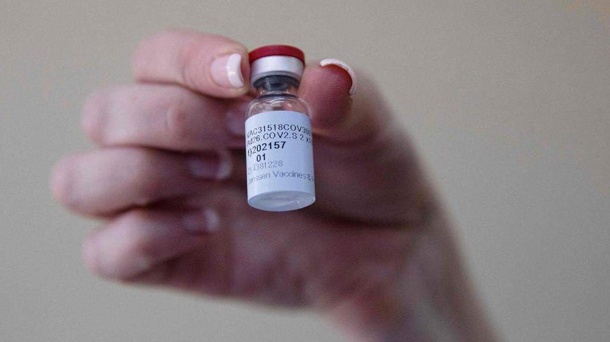In this photo taken Feb. 18, 2021, a health care worker holds a dose of the Johnson & Johnson COVID-19 coronavirus vaccine.