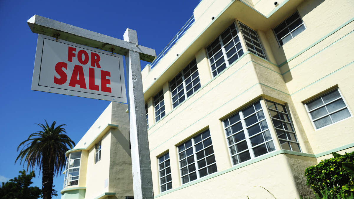 Blank Real Estate Agent Sign with Art Deco Apartment Building