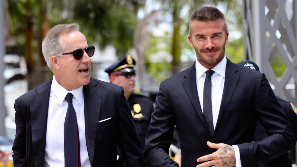 Jorge Mas, left, and David Beckham on their way to make their case before the Miami City Commission in July.