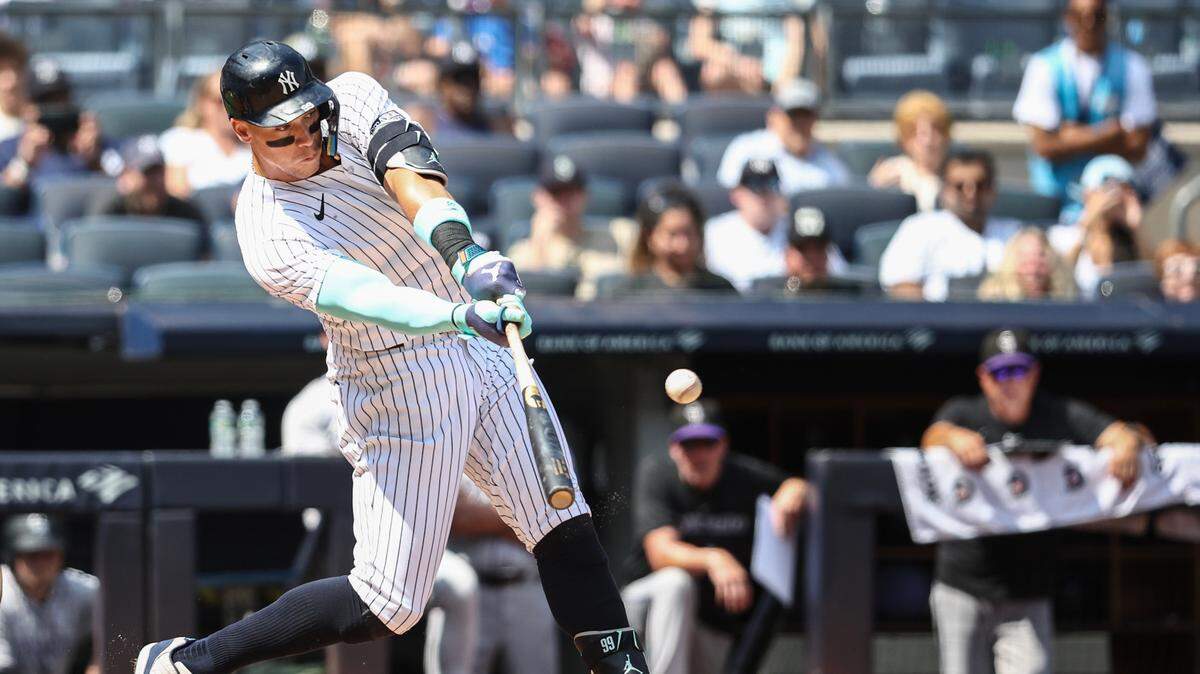 Aug 25, 2024; Bronx, New York, USA; New York Yankees center fielder Aaron Judge (99) hits a two run home run in the first inning against the Colorado Rockies at Yankee Stadium. Mandatory Credit: Wendell Cruz-USA TODAY Sports