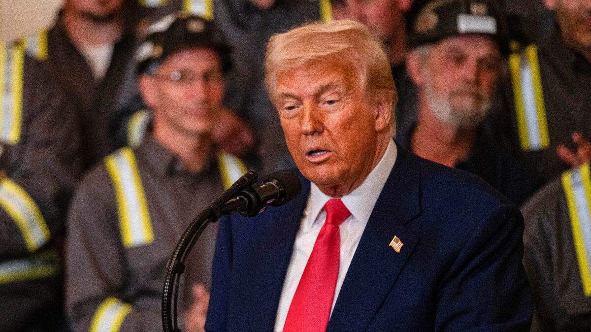 President Donald Trump, surrounded by miners, signed four executive orders to strengthen the coal industry on April 8.