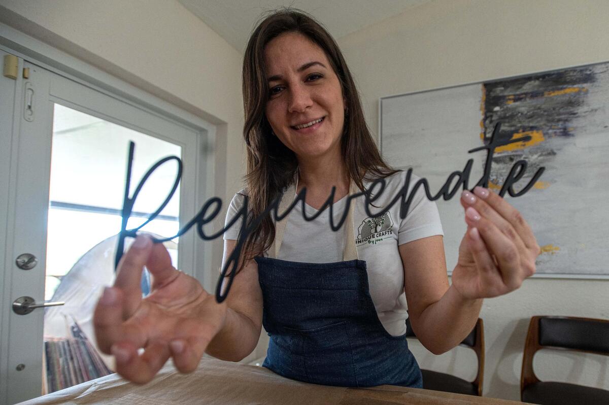 Cuban-American entrepreneur Jennifer Arniella in her home in southwest Miami, where she started her business, Unique Crafts by Jenn, during the pandemic. In little more than a year it has proved successful, allowing her to meet with President Biden at the White House on April 29.