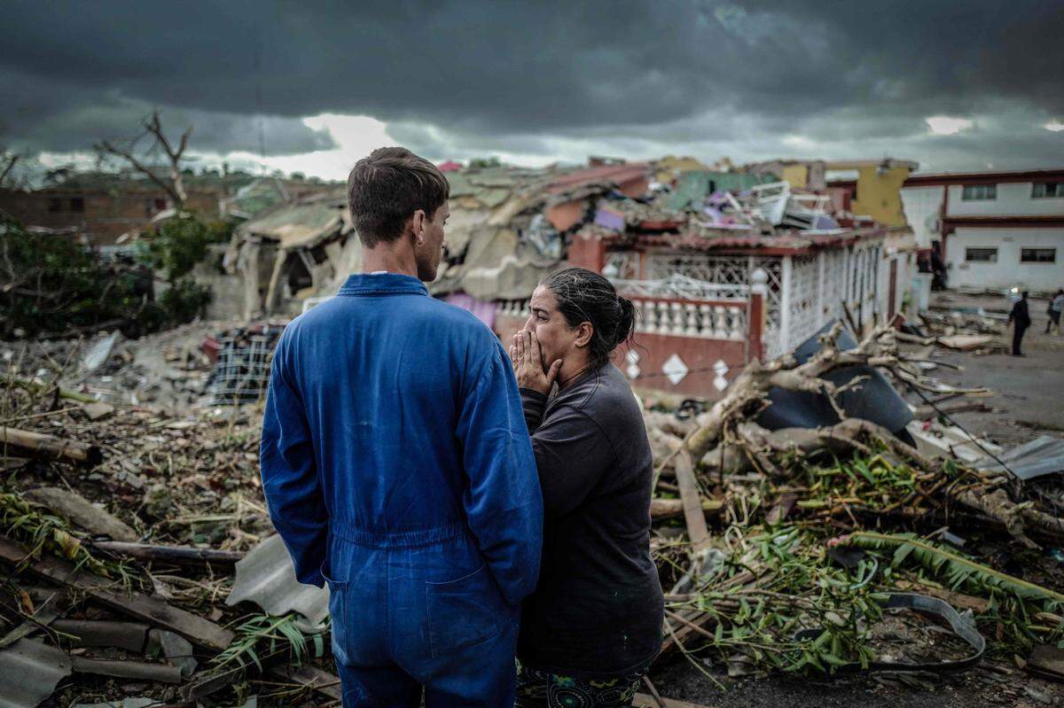 TOPSHOT - A resident of tornado-hit Regla neighbourhood cries in front of her destroyed house, in Havana, on January 28, 2019. - A rare and powerful tornado that struck Havana killed three people and left 172 injured, Cuban President Miguel Diaz-Canel said early Monday. (Photo by ADALBERTO ROQUE / AFP)ADALBERTO ROQUE/AFP/Getty Images