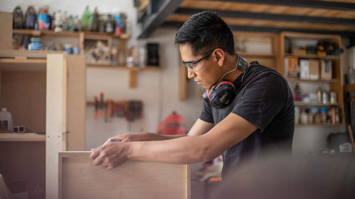 Mexican man working in woodworking shop