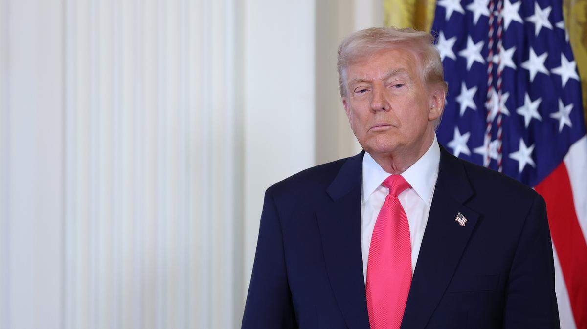 WASHINGTON, DC - NOVEMBER 13: U.S. President Donald Trump listens as first lady Melania Trump speaks at a signing ceremony for the "Fostering the Future" executive order in the East Room of the White House on November 13, 2025 in Washington, DC. The executive order, championed by the first lady, works to expand opportunities for education, career development, housing and other resources for youth transitioning from foster care to adulthood. (Photo by Anna Moneymaker/Getty Images)