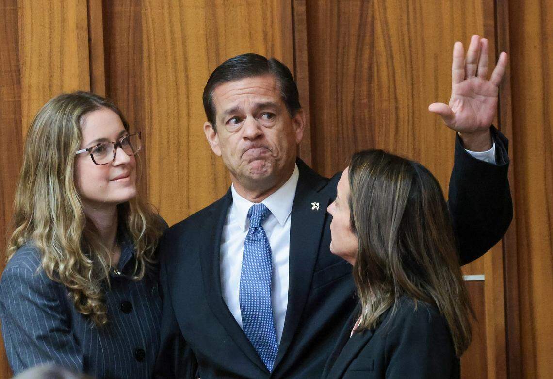 Surrounded by his daughter, Carolina Pino, left, and his wife, Cecilia Pino, right, real estate broker George Pino greets supporters as they arrive in Courtroom 4-1 for his surrender at the Richard E. Gerstein Justice Building on Thursday, November 21, 2024, in Miami, Florida.