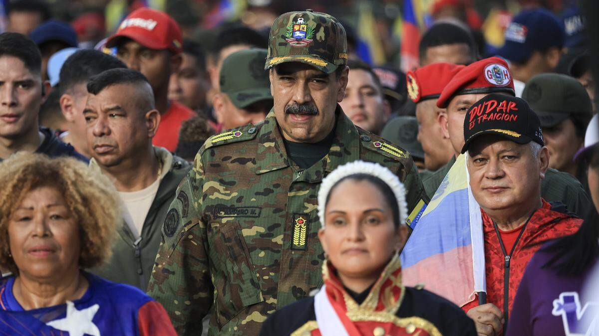 CARACAS, VENEZUELA - NOVEMBER 25: President of Venezuela NicolÃ(degrees)s Maduro participates in a civic-military rally on November 25, 2025, in Caracas, Venezuela. The United States recently designated the "Cartel De Los Soles" (Cartel of The Suns) as a foreign terrorist organization, a group allegedly led by the president of Venezuela, Nicolas Maduro, and which, it is presumed, includes high-ranking members of the Venezuelan government. (Photo by Jesus Vargas/Getty Images)