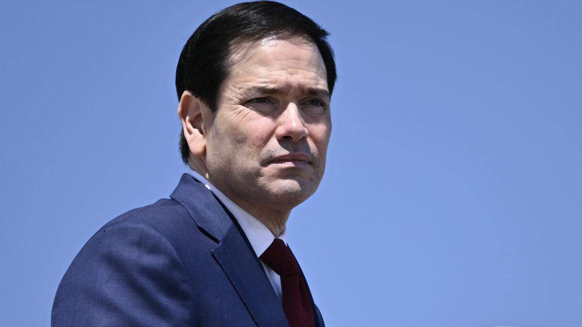US Secretary of State Marco Rubio boards Air Force One at Joint Base Andrews, Maryland, on May 12, 2026 as he departs for a 3-day state visit to China. President Trump said Monday he was ready to discuss US arms sales to Taiwan during his visit this week to Beijing, as he suggested his personal chemistry with counterpart Xi Jinping would prevent a Chinese invasion of the island. Trump will bring along top US executives for a trip expected to focus heavily on the US president's hopes to ramp up trade. (Photo by Brendan SMIALOWSKI / AFP via Getty Images)