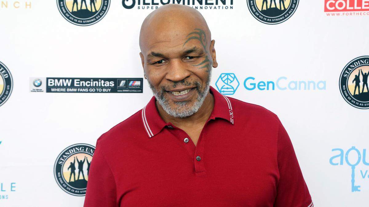 Video obtained by TMZ shows legendary boxer Mike Tyson punching a man on a flight from San Francisco to Florida on Wednesday night.