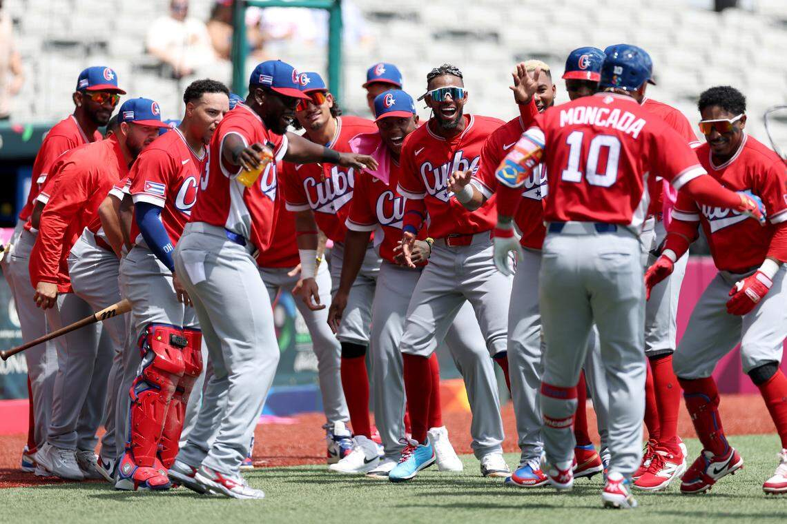 SAN JUAN, PUERTO RICO - MARCH 06: Yoán Moncada #10 of the Team Cuba celebrates with teammates after hitting a two-run home run against the Team Panama during the third inning at Hiram Bithorn Stadium on March 06, 2026 in San Juan, Puerto Rico. (Photo by Al Bello/Getty Images)