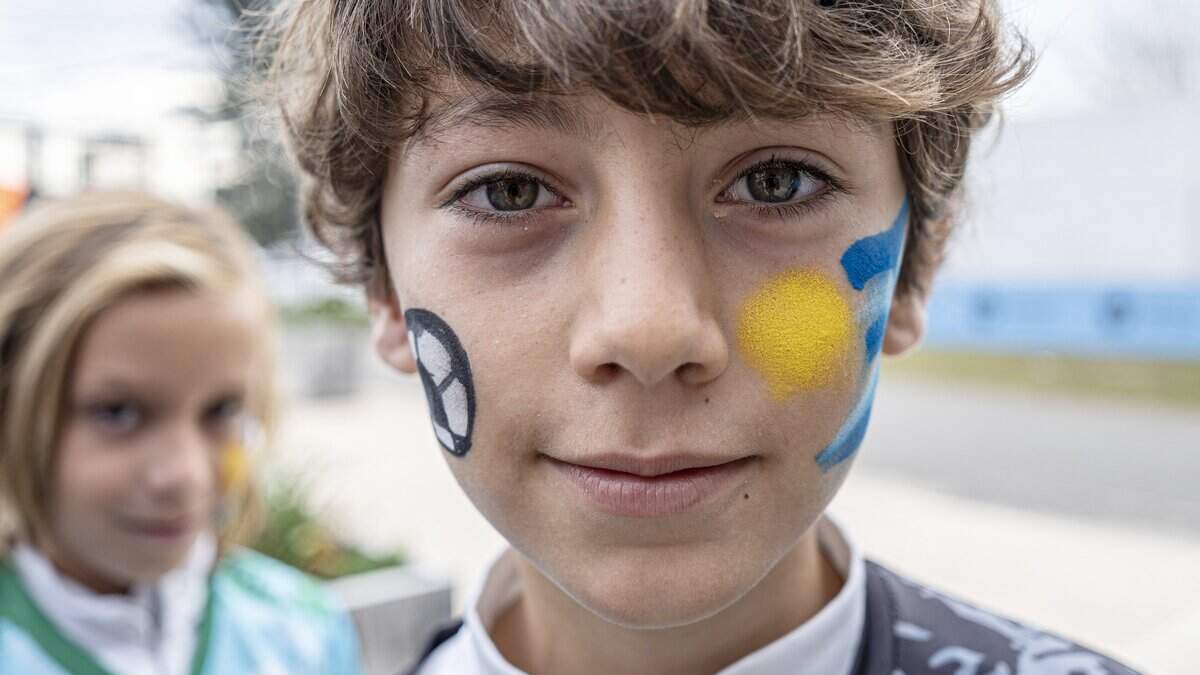 CANELONES, URUGUAY - JUNE 05: A fan of Uruguay with the face painted looks at the camera during a farewell activity for Uruguay national team ahead of the 2026 FIFA World Cup at Estadio Emilio "Tito" López López de Pando on June 05, 2026 in Canelones, Uruguay. (Photo by Ernesto Ryan/Getty Images)