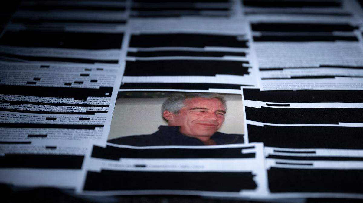 TOPSHOT - This photo illustration shows redacted documents from the Epstein Library files released by the US Department of Justice in Washington, DC, on February 18, 2026. The Epstein Files Transparency Act (EFTA), passed overwhelmingly by Congress in November 2025, compelled the Justice Department to release all of the documents in its possession related to the disgraced financier Jeffrey Epstein within 30 days. (Photo by Brendan Smialowski / AFP via Getty Images) / -- IMAGE RESTRICTED TO EDITORIAL USE - STRICTLY NO COMMERCIAL USE --