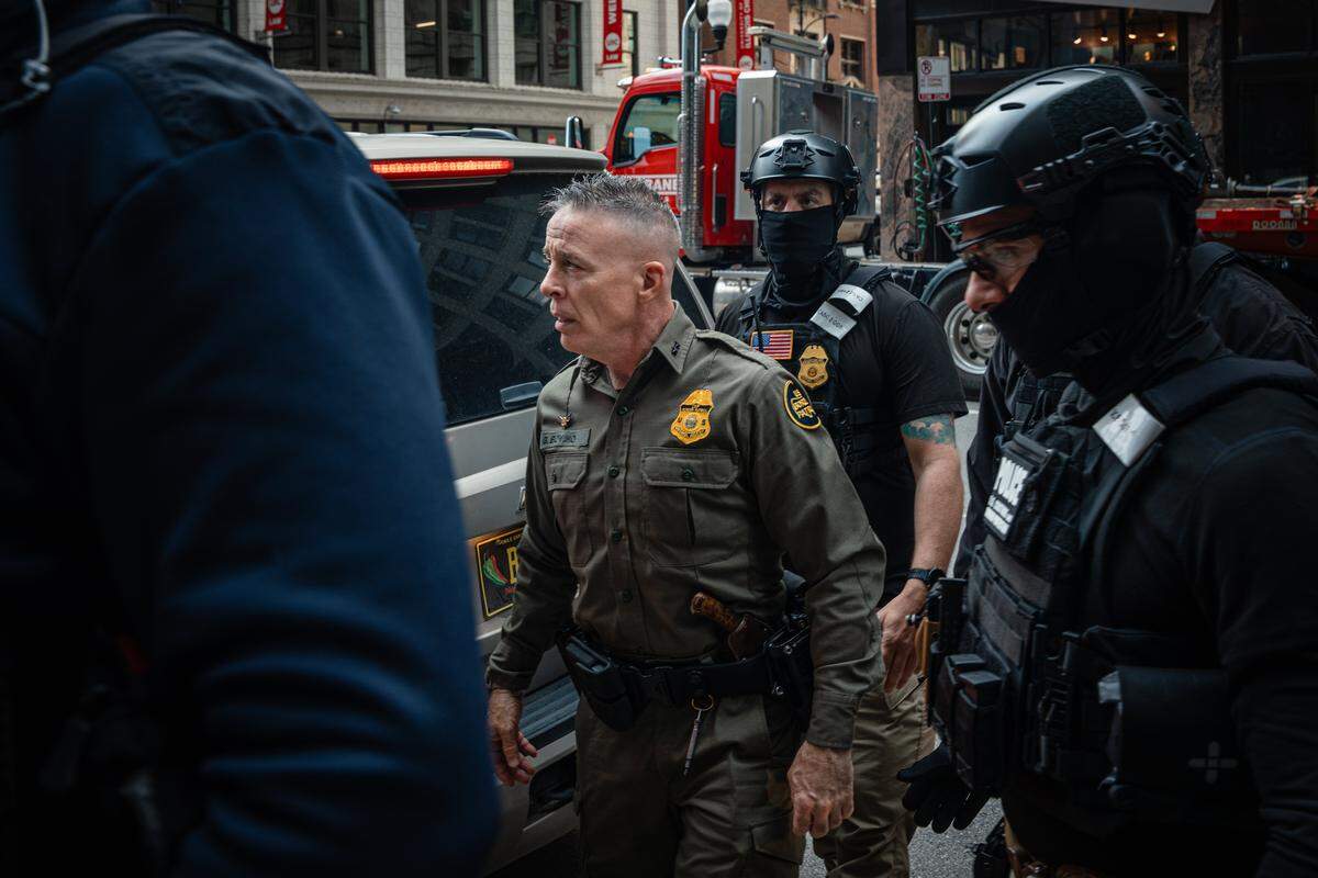 CHICAGO, ILLINOIS - OCTOBER 28: U.S. Border Patrol commander Gregory Bovino pushes through a crowd of media and protesters as he enters the Dirksen Federal Building on October 28, 2025, in Chicago, Illinois. Bovino is appearing before U.S. District Judge Sara Ellis amid accusations that he and agents under his command have defied court limits on tear gas and other crowd control tactics during President Donald Trump's Operation Midway Blitz enforcement surge across Chicago and the suburbs.(Photo by Jamie Kelter Davis/Getty Images)
