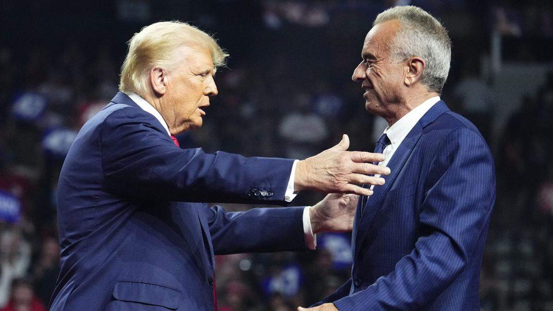 Donald Trump embraces Robert F. Kennedy Jr. at Desert Diamond Arena in Glendale Aug. 23, 2024.