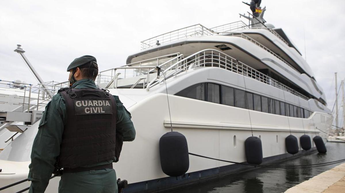 A civil guardsman stands vigil by the oligarch-owned yacht Tango in Spain on April 4, 2022. AP/Francisco Ubilla