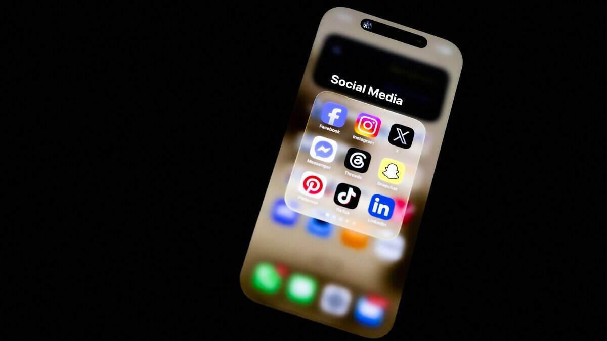Social media icons displayed on a smartphone held in hand are seen in this illustration photo taken in Sartene Corsica France on May 15, 2026. (Photo by Grichka BEYSSON-LEANDRI / Hans Lucas / AFP via Getty Images)