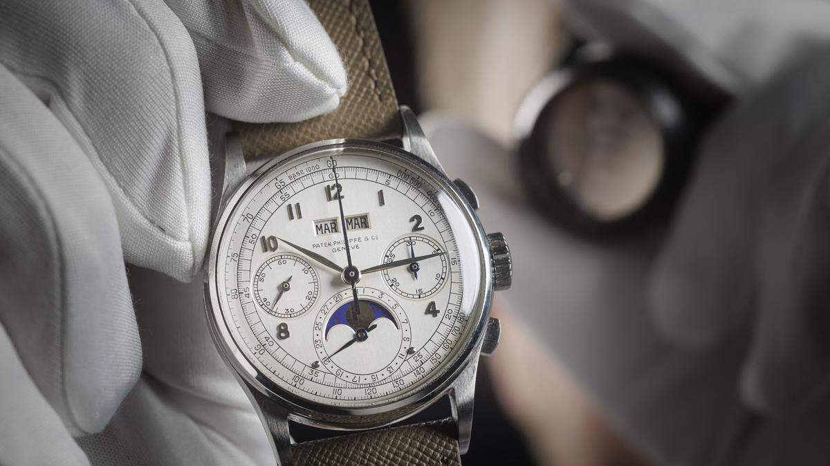 TOPSHOT - This photograph shows a rare Patek Philippe - Reference 1518 steel watch manufactured in 1943 and expected to fetch more than 10 million dollars at the Phillips auction house in Geneva on November 8, 2025. (Photo by Valentin Flauraud / AFP) (Photo by VALENTIN FLAURAUD/AFP via Getty Images)