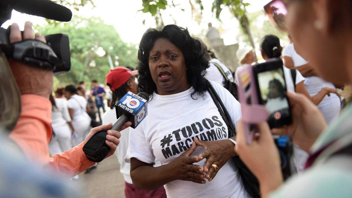 Mar 20, 2016; Havana, Cuba; Berta Soler, one of the original members of the Ladies in White, a group that protests against the Cuban government, is interviewed before the start of their weekly protest march. The group formed in 2003 after 75 human rights activists, dissidents and journalists were arrested by Cuban authorities Mandatory Credit: Jack Gruber-USA TODAY NETWORK